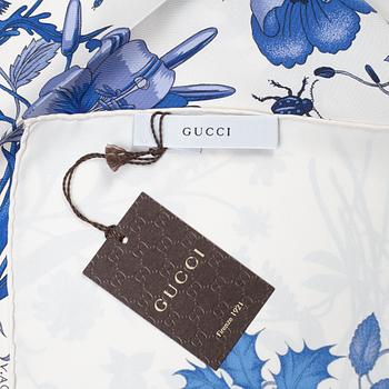 Gucci, a 'Flora' twill silk scarf.