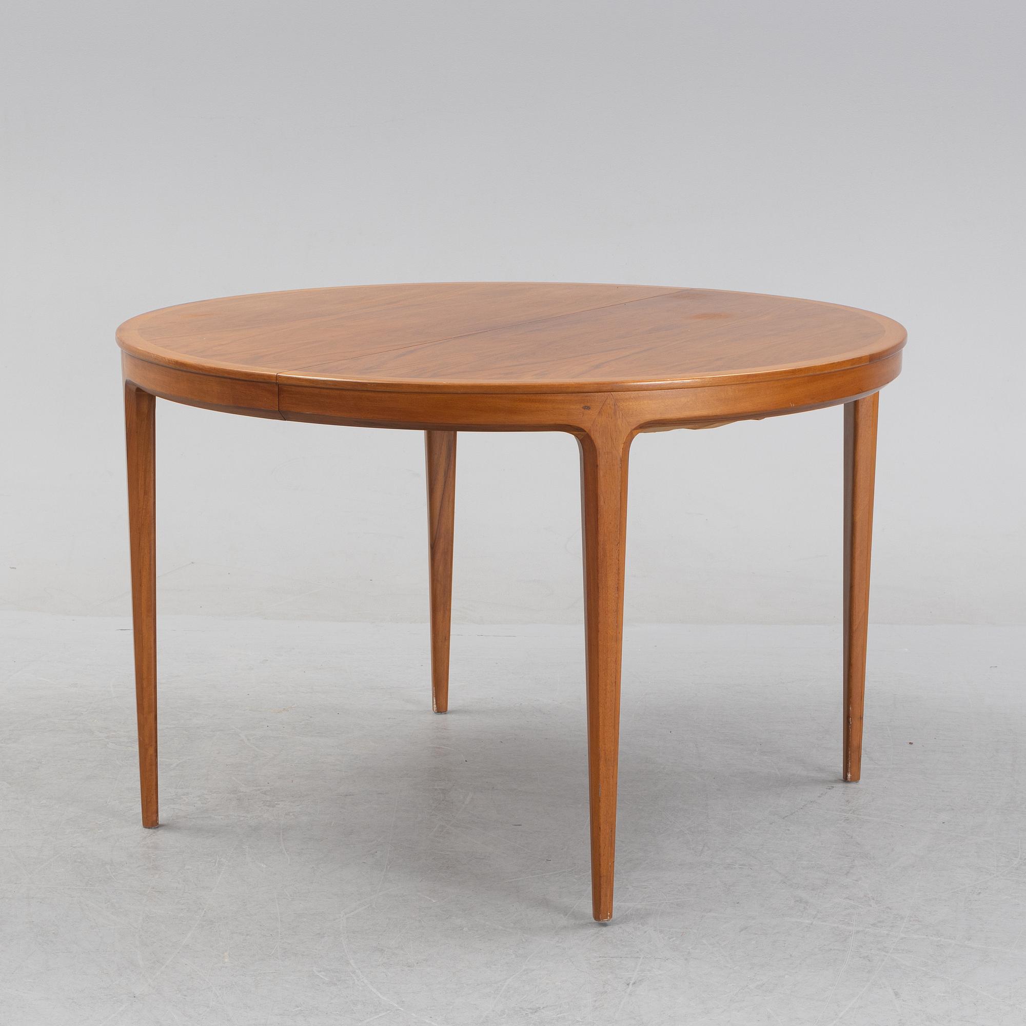 Bertil Fridhagen, a 'Diamant' walnut veneered dining table, with four additional leaves.  Bodafors.