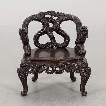 A Chinese 20th century wooden armchair.