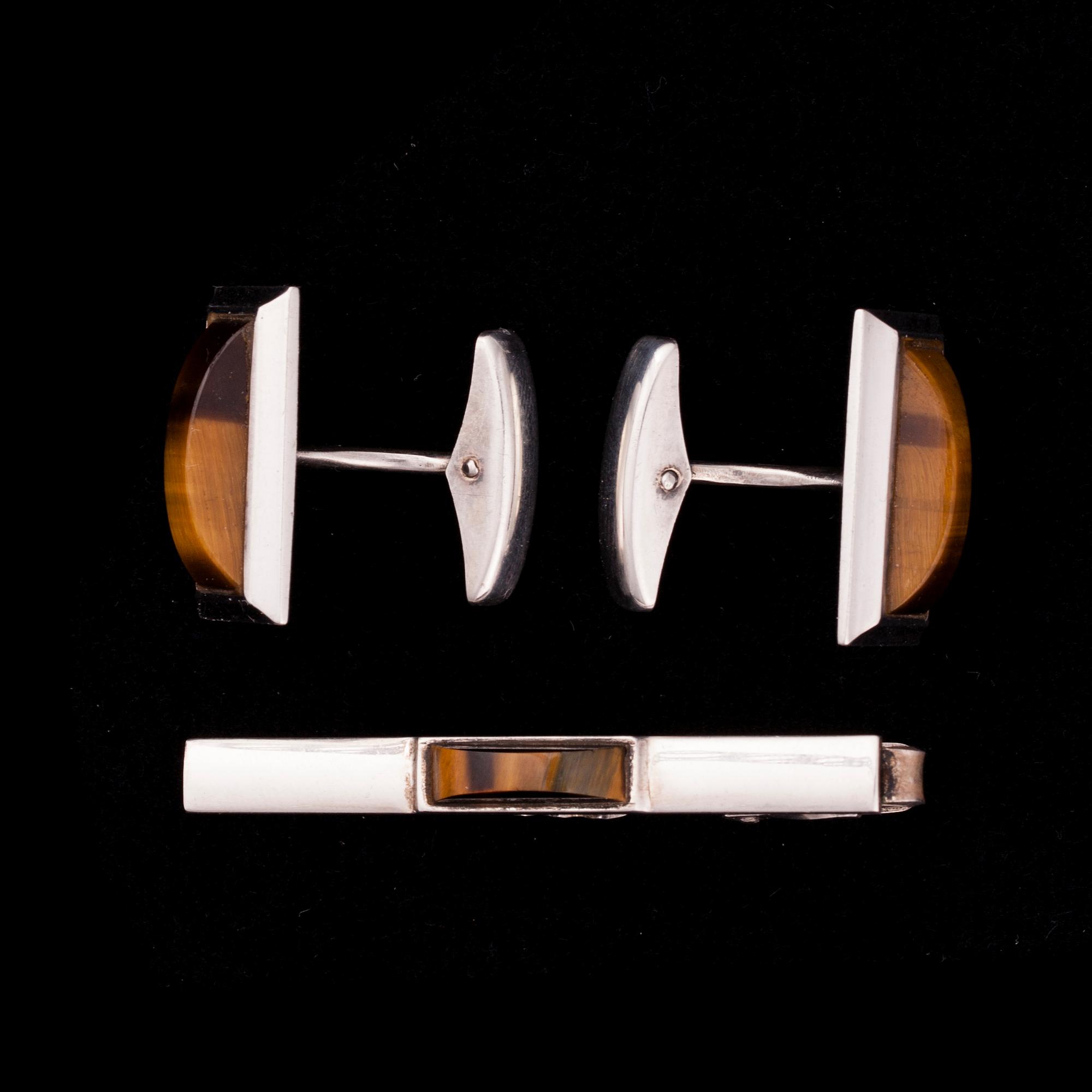 MANSCHETTKNAPPAR och SLIPSNÅL, silver samt tigeröga, Helsingfors 1964.