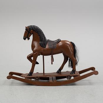 A painted rocking horse from around 1900.