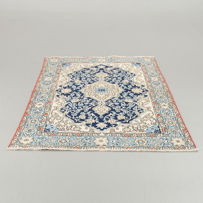 An old Shahreza carpet ca 221 x 138 cm.