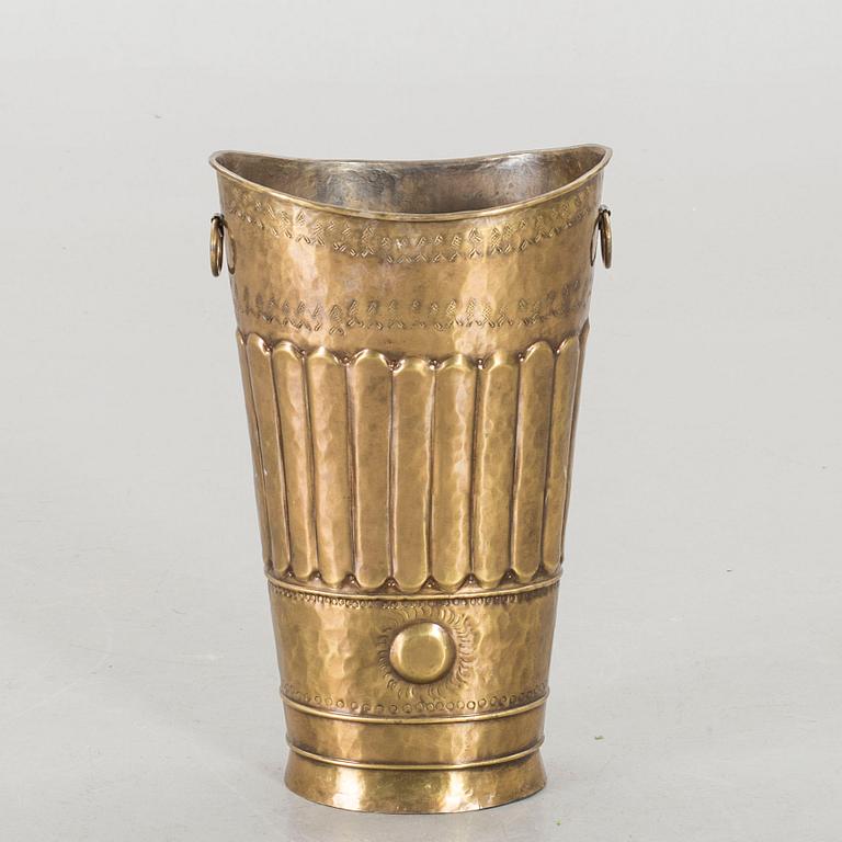 A BRASS UMBRELLA STAND.