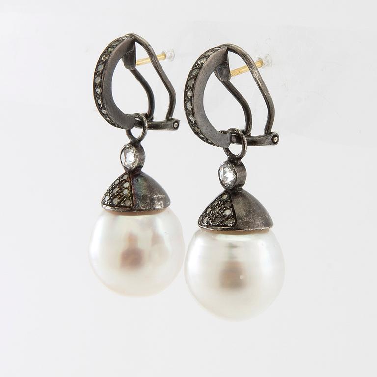 Earrings, a pair of oxidised silver with diamonds and cultured drop-shaped pearls.