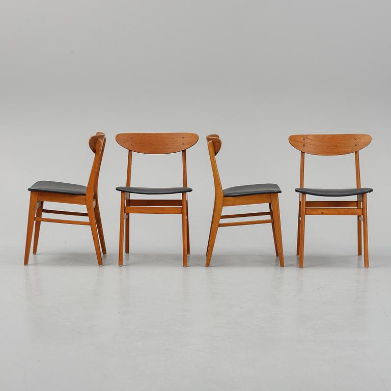 A teak dining table with 4 'Monaco' chairs, mid 20th century.