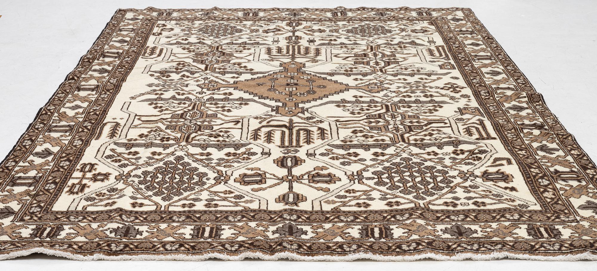 A Ferdos carpet, c. 295 x 210 cm.