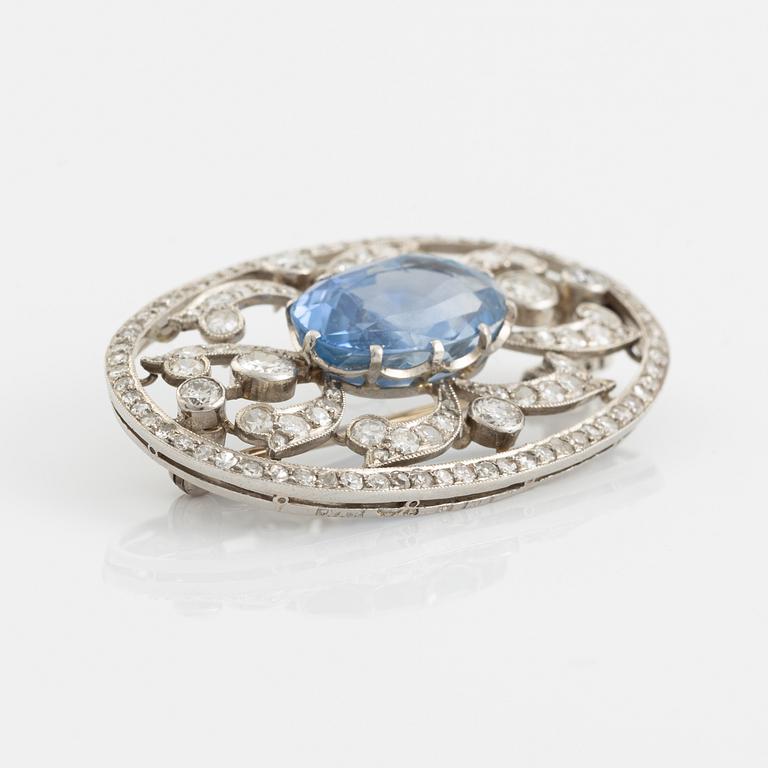 A WA Bolin brooch in platinum set with a faceted sapphire and old- and eight-cut diamonds.