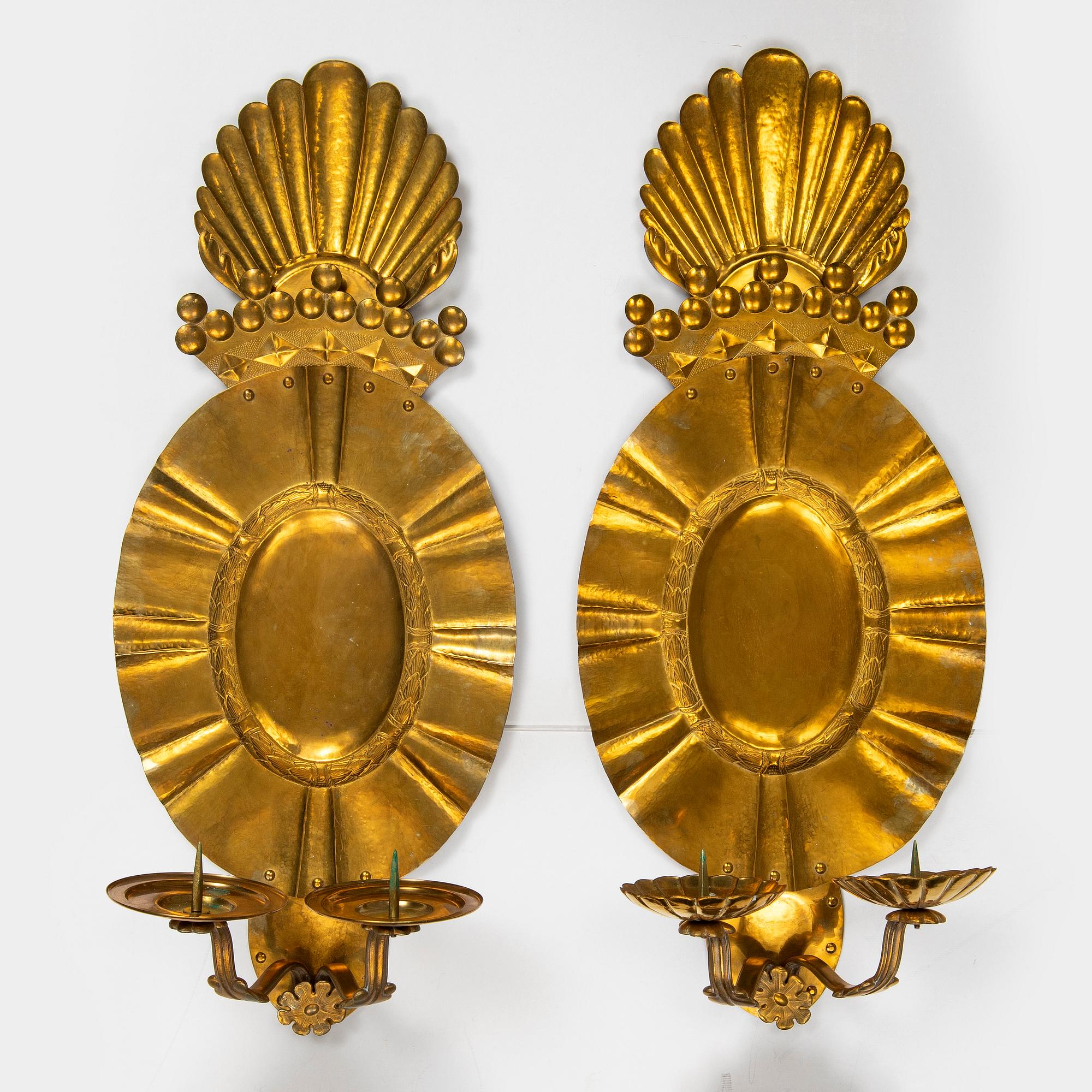 A set of four baroque style brass wall sconces, probably 1950s.