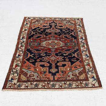 A Heriz rug, c. 192 x 133-139 cm.