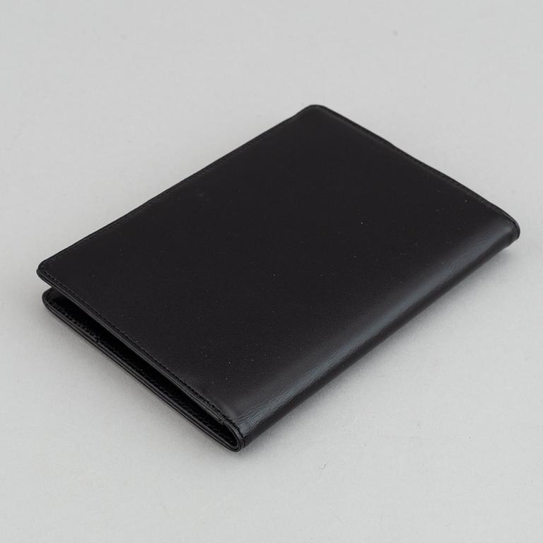 MOntblanc, a ball point pen and leather passport holder.