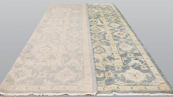 An oriental carpet, ca 425 x 300 cm.