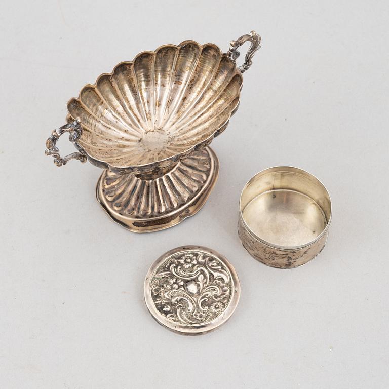 Goblet on foot, hand mirror, and box, silver.