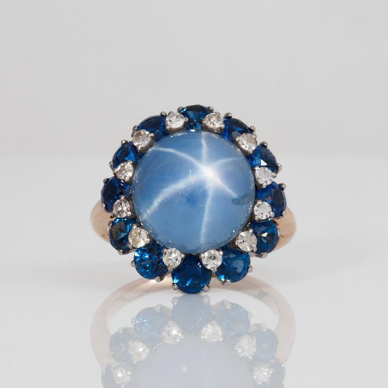 An untreated 10.60 ct star sapphire, brilliant-cut diamond and fancy cut sapphire ring.