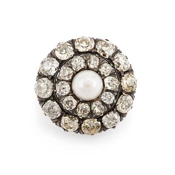 536. A silver and gold brooch, with cushion-cut diamonds and a pearl.