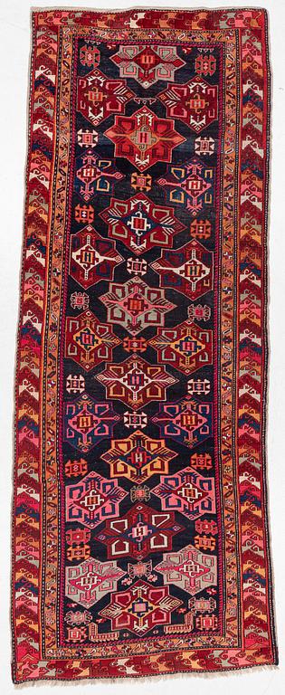 A semi-antique Anatolian runner, c. 409 x 159 cm.