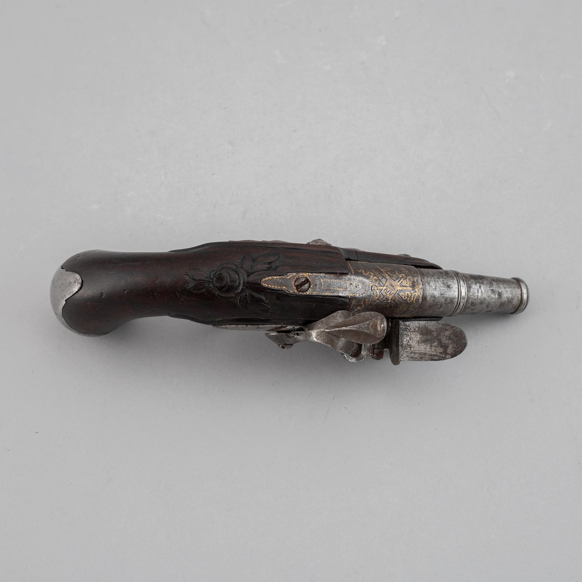 A 18th Century flintlock pistol.