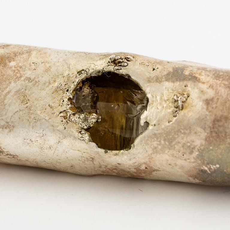 Earrings, possibly Slim Barrett.