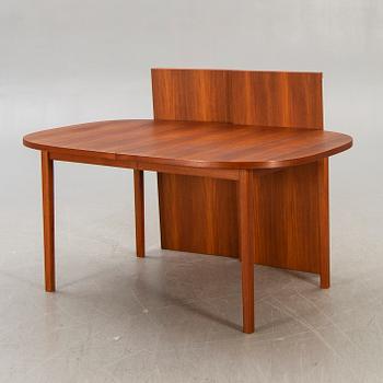 A 1960s/70s teak dining table.