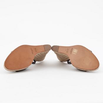 YVES SAINT LAURENT, a pair of straw and leather wedge sandals.