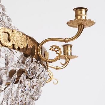 An Empire nine-light gilt-brass and cut-glass, Stockholm, early 19th century.