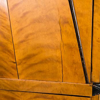 An early 19th century A SECRETAIRE CHEST OF DRAWERS.