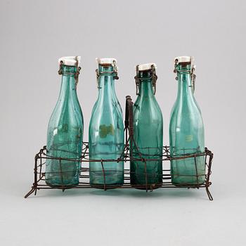 A metal bottle holder, first half of the 20th century.