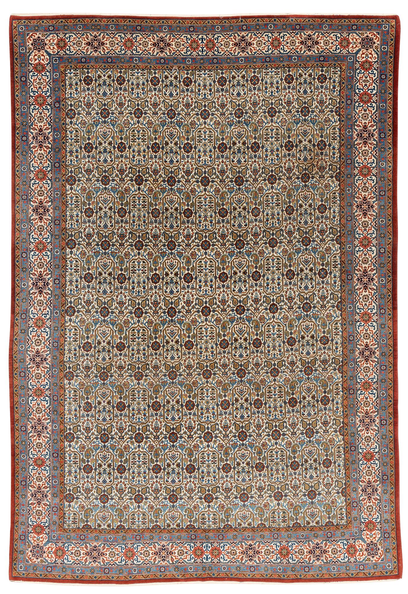 A carpet, semi-antique, Qum, ca 324 x 221 cm.