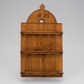 A folk art spoon shelf dated 1833.