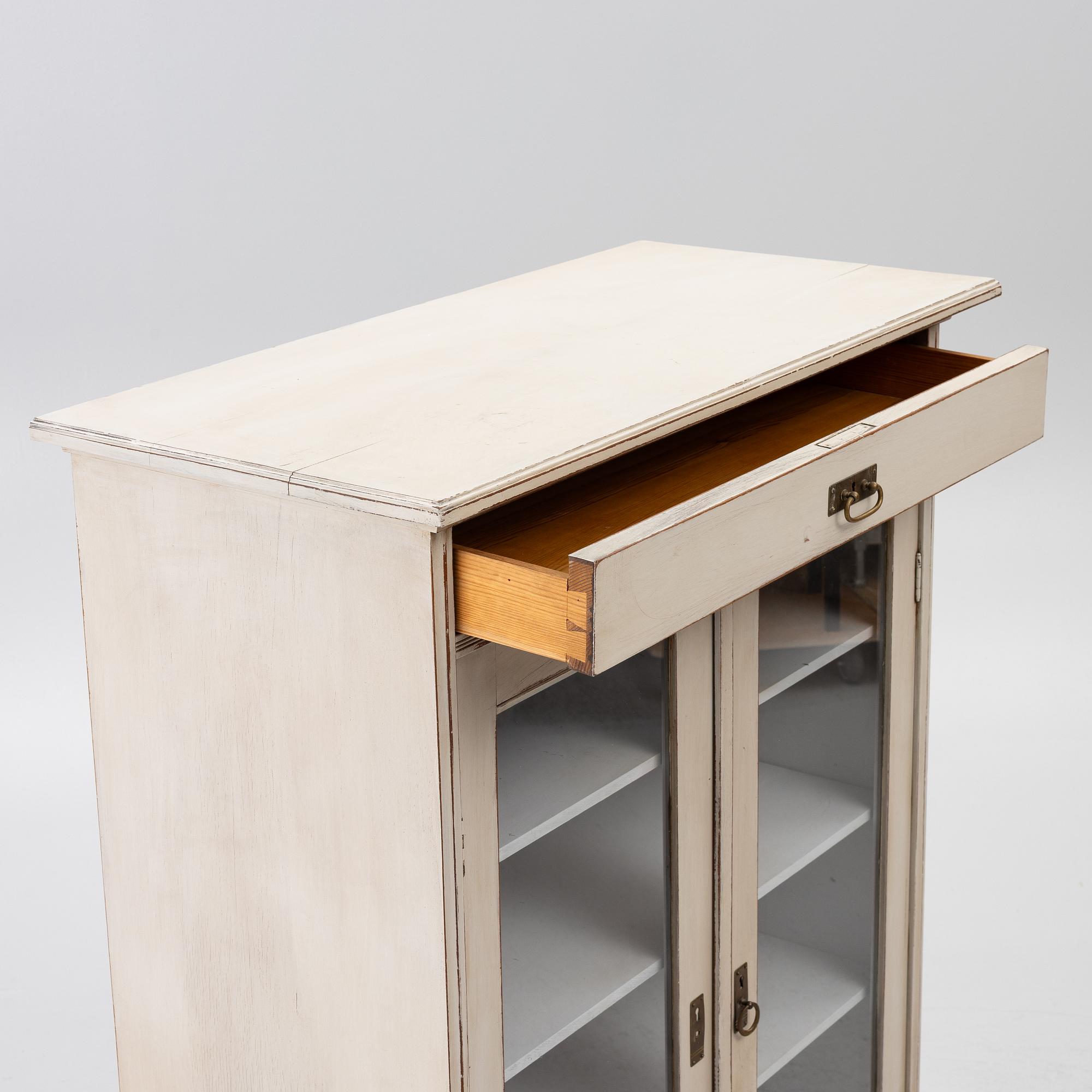 Display cabinet, early 20th century.