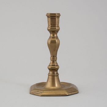 An 18th century bronze candlestick.