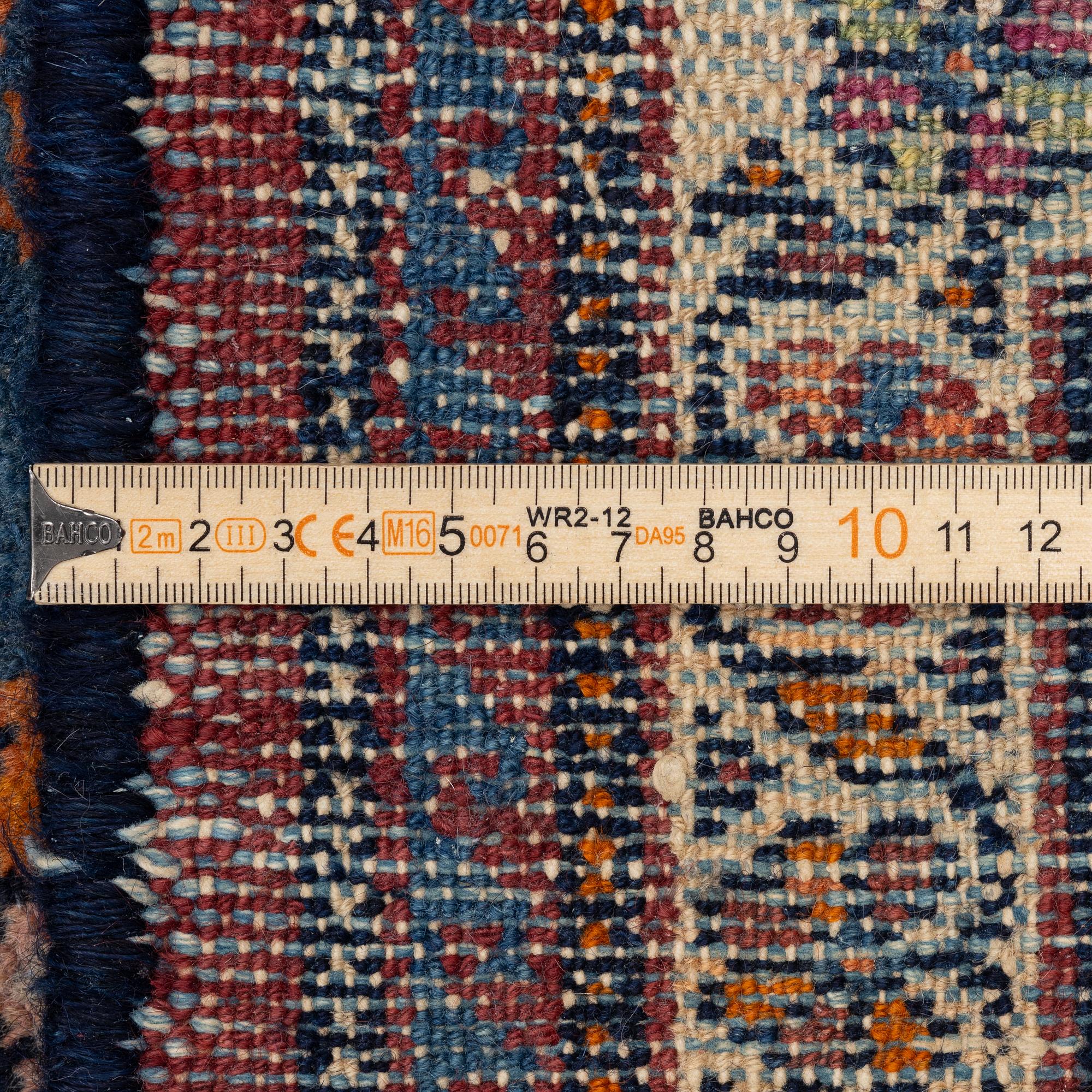 A north-west Persian, semi-antique runner, c. 340 x 110 cm.