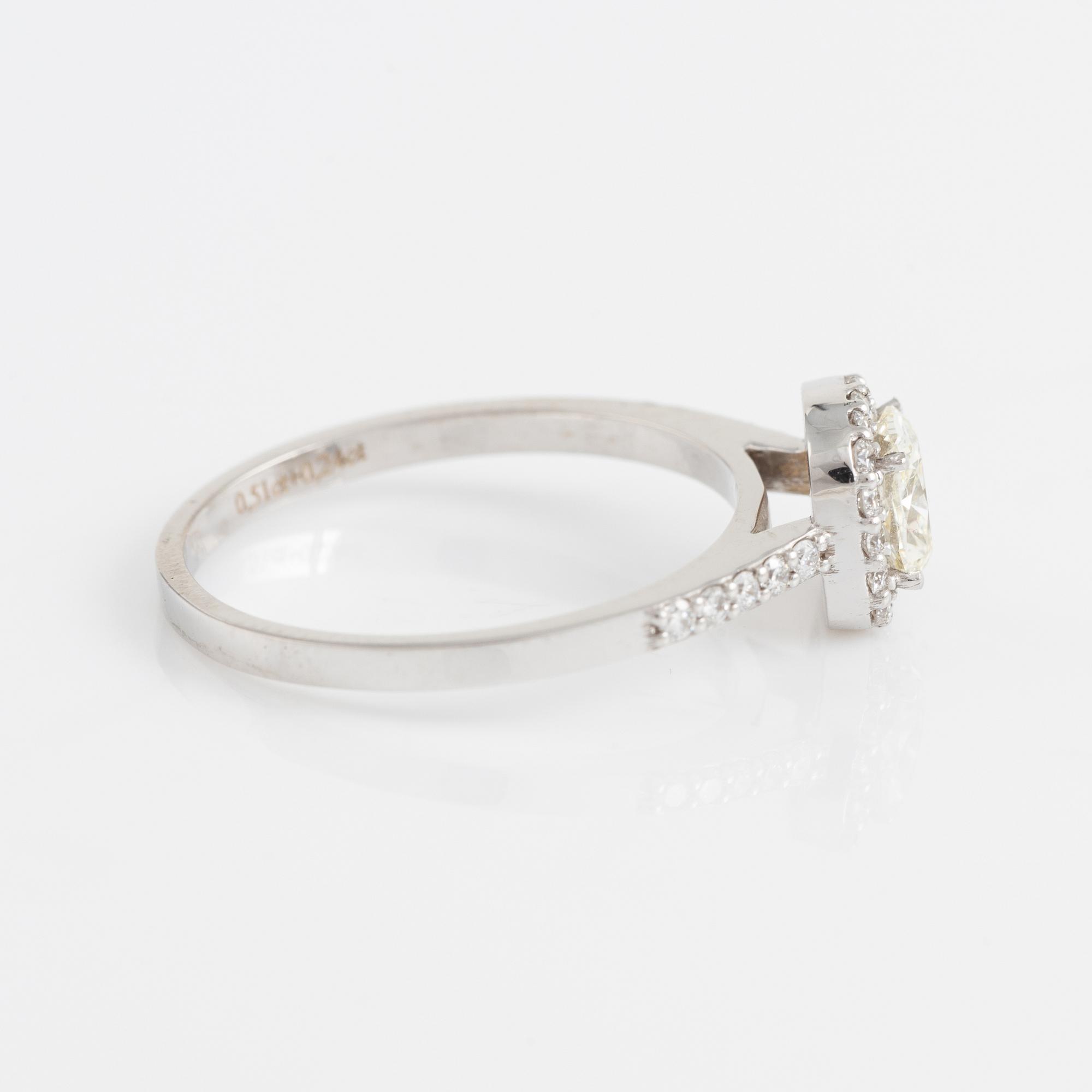 Cushion cut diamond and brilliant cut diamond ring.