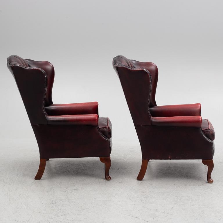 A pair of leather armchairs, end of the 20th century.