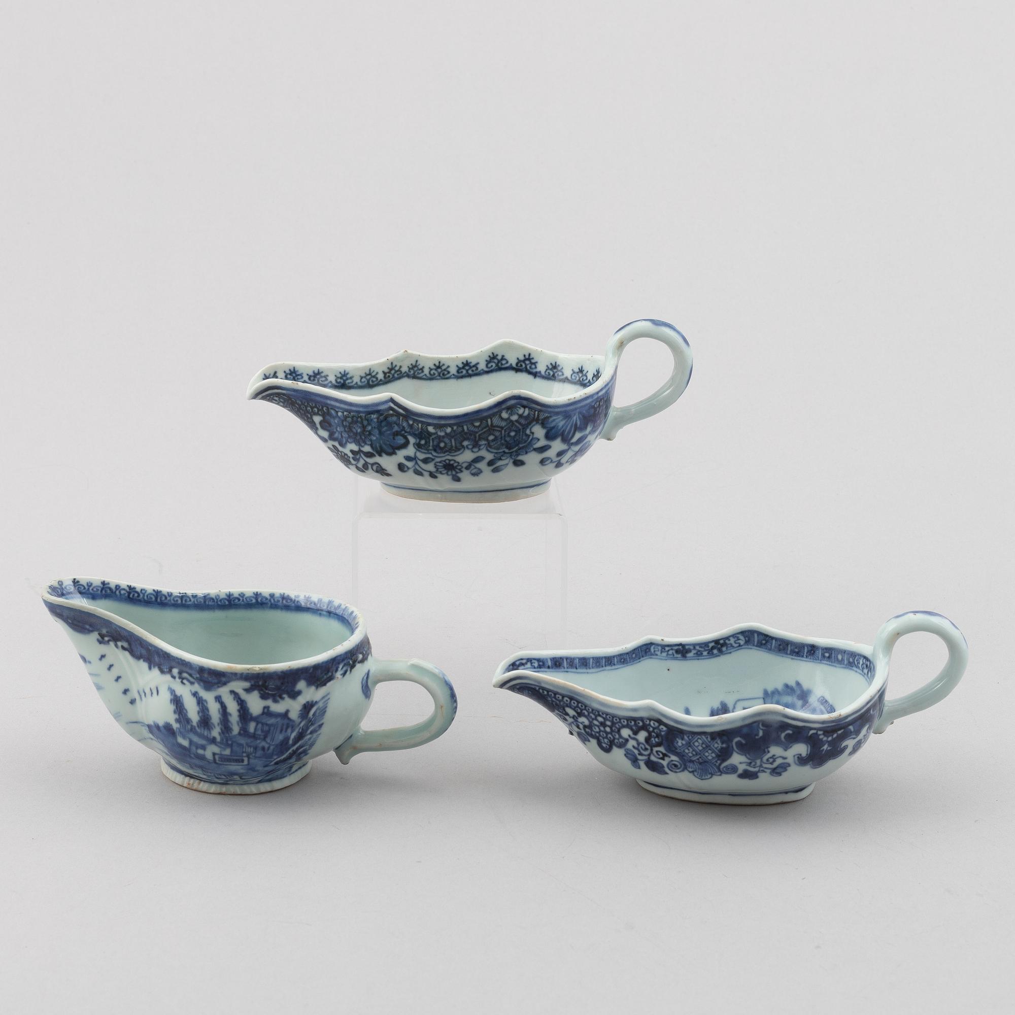 A group of three Chinese blue and white sauce boats, Qing dynsty, Qianlong (1736-95).