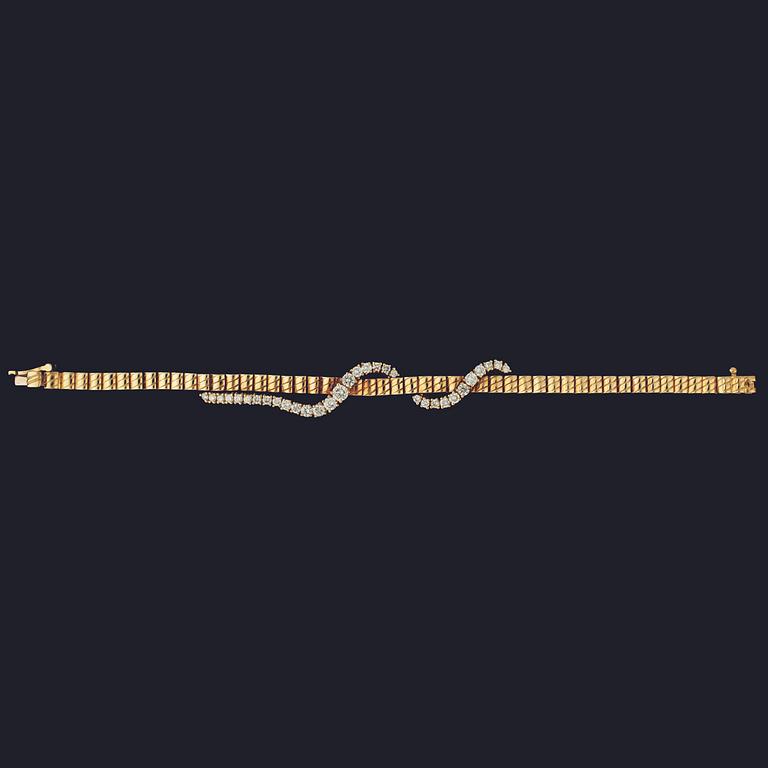 A gold and brilliant cut diamond bracelet, tot. app. 1.70 cts.