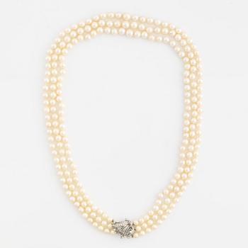 Cultured pearl necklace, three strand, calibrated, clasp with diamonds.