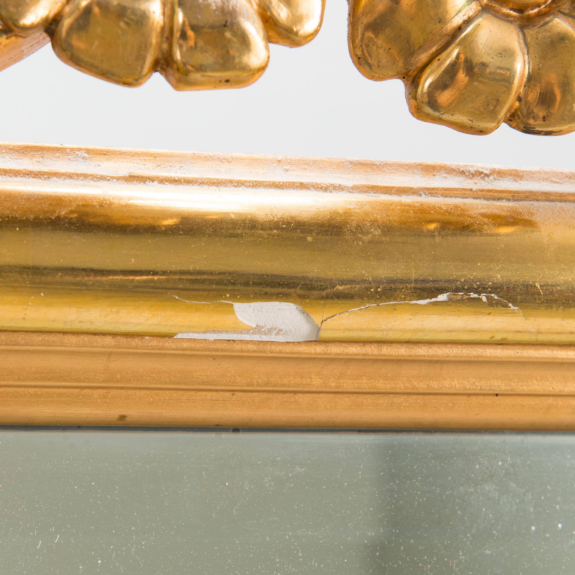 An Art Nouveau mirror with console table from early 20th century.