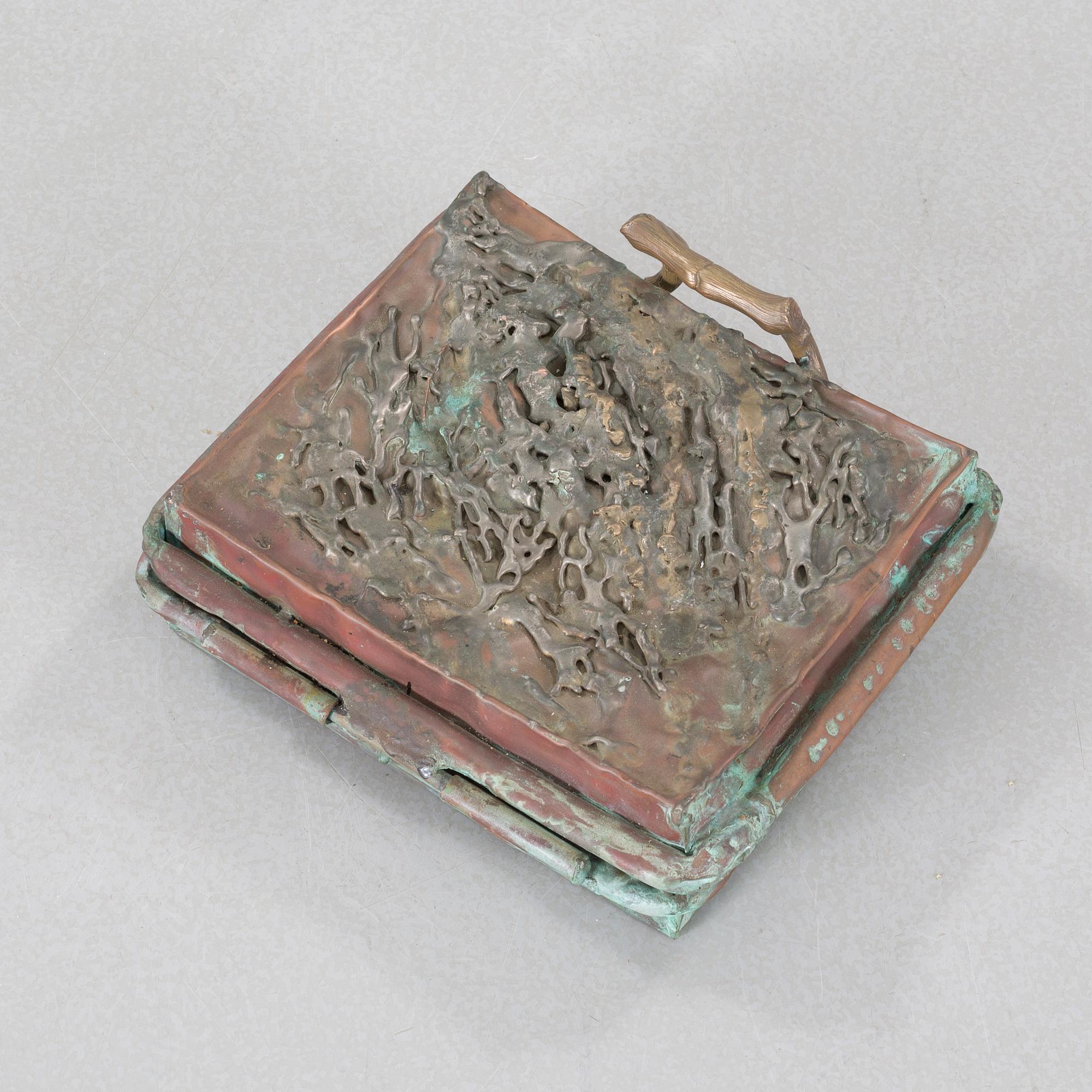a metal sculpture, signed and dated -83.
