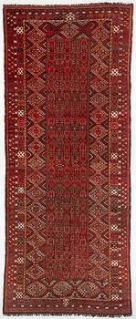 An antique Beshir rug, westTurkmenistan, c. 597 x 240 cm.