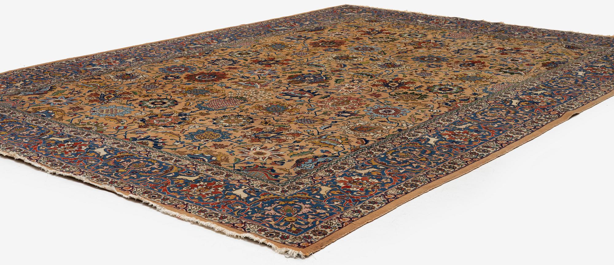 A semi-antique Tabriz carpet of vase design, West Persia, c. 404 x 292 cm.