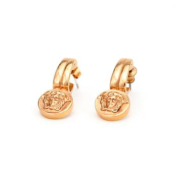 466. VERSACE, a pair of gold colored earrings.