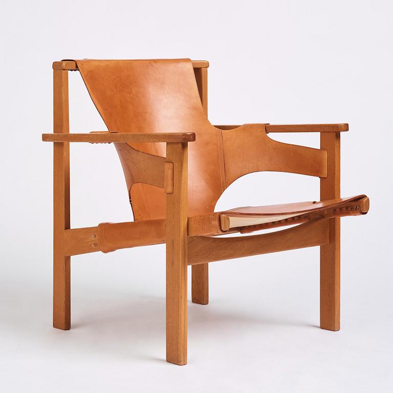 Carl-Axel Acking, an oak and brown natural leather 'Trienna' chair, Nordiska Kompaniet, Sweden.