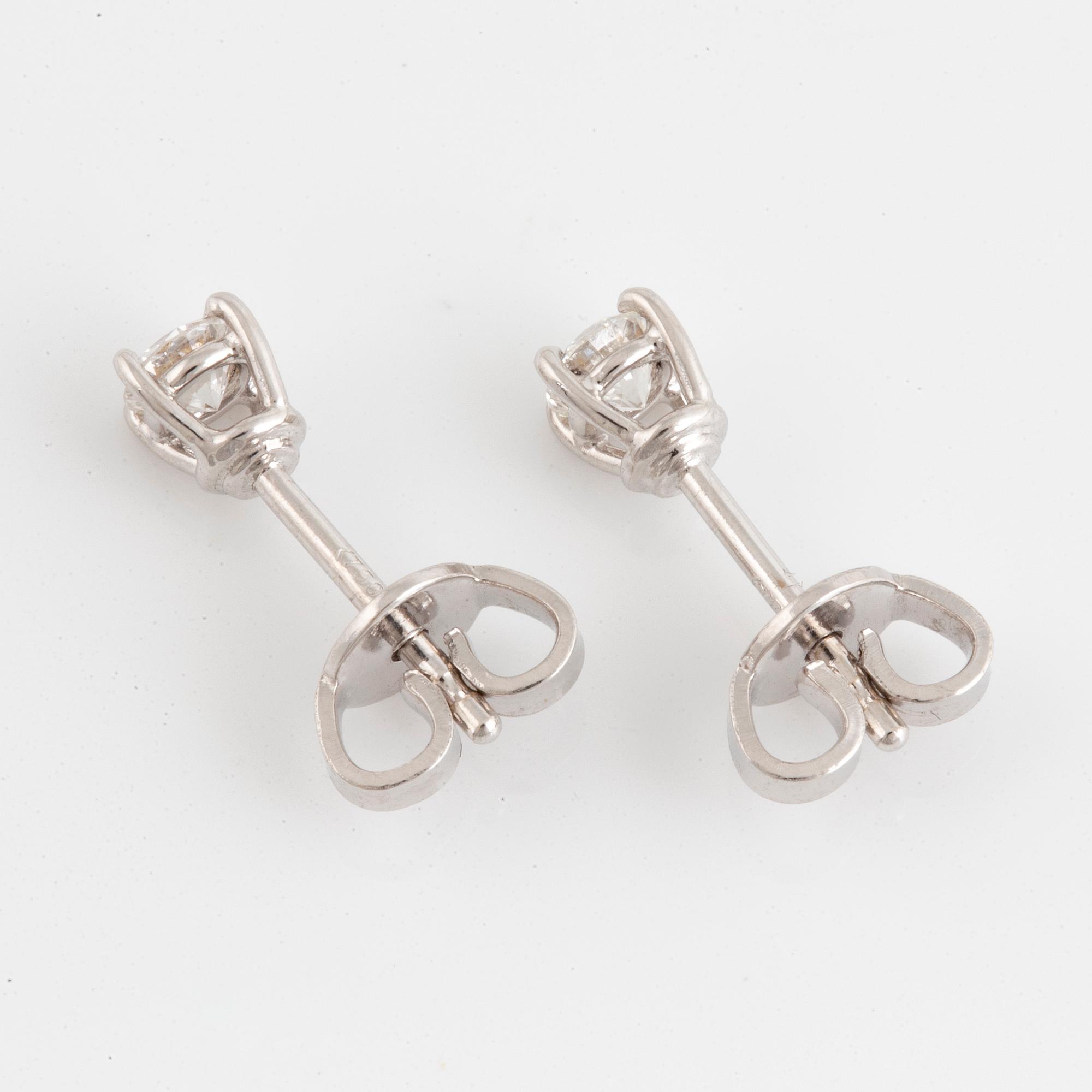 Brilliant-cut diamond stud earrings.