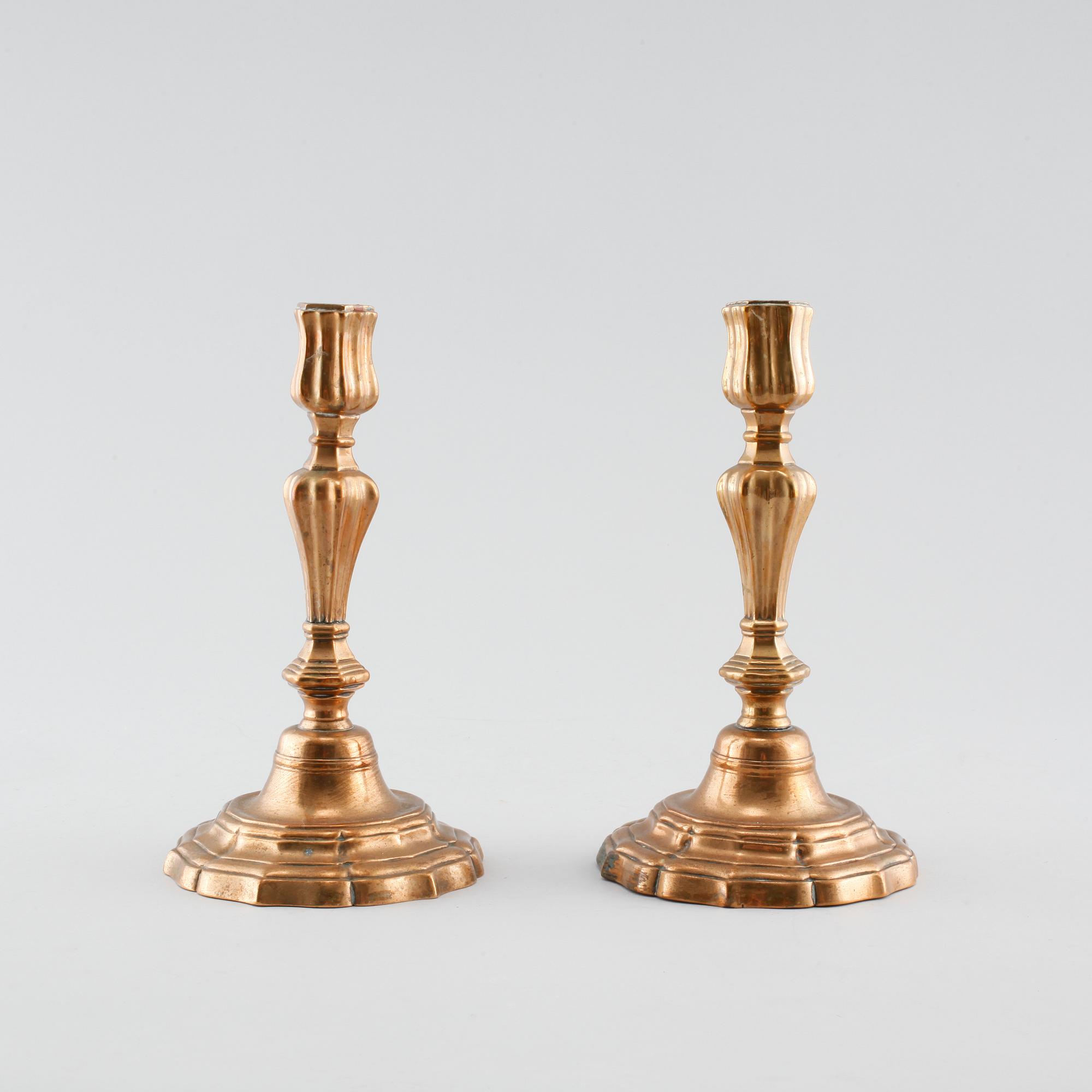 A pair of late barouqe bronze candlesticks, 18th century.