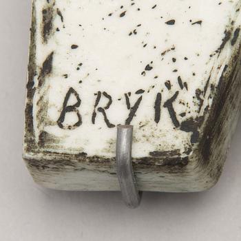 A stoneware relief signed BRYK.