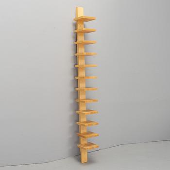 JOHN KANDELL, a "pilaster" wall shelf from the late 1900's.