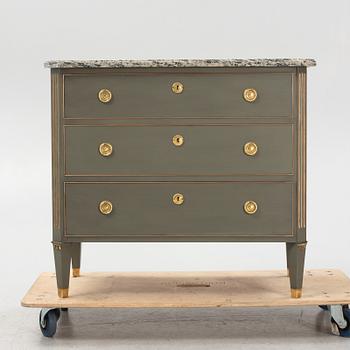 A painted Gustavians style chest of drawers with stone top, first part of the 20th Century.