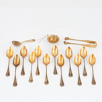 Philippe Berthier, 13 spoons, a sugar tongs and a tea strainer, gilded silver, Paris, France, 1841-51.