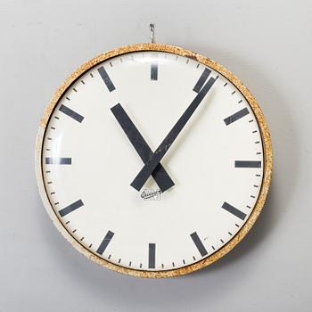 A METAL FRAMED WALL CLOCK, dial marked LM Ericsson, second half of the 20th century.