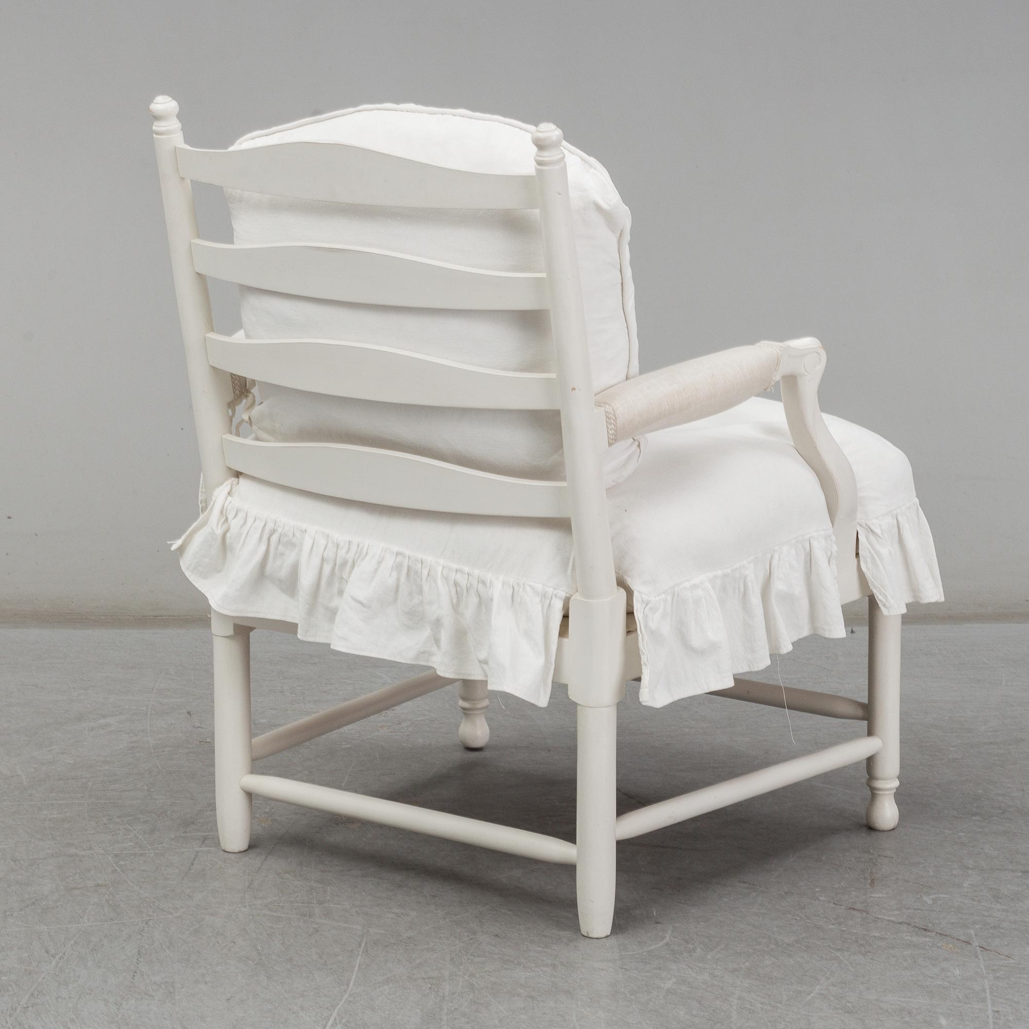 A Gustavian-style late 20th century armchair.